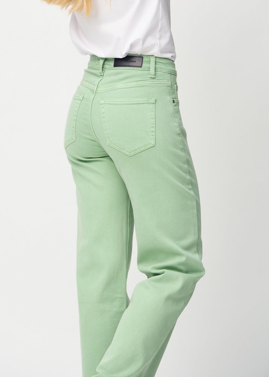 Loose jeans for women in light green, color Mints. Close-up from behind on a model, showing the fit and details.