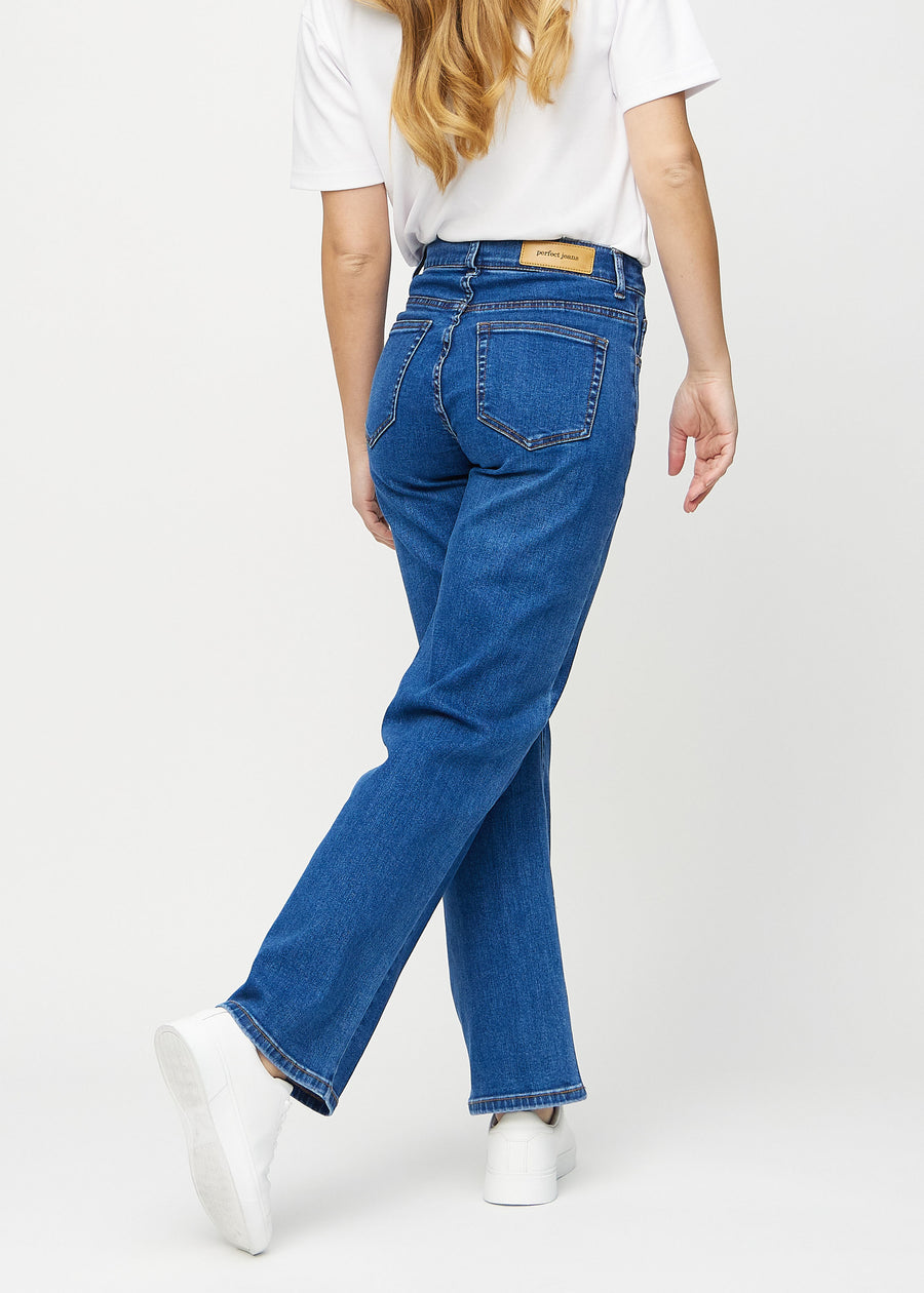 Dark denim loose jeans seen from the back, so the entire product can be seen.