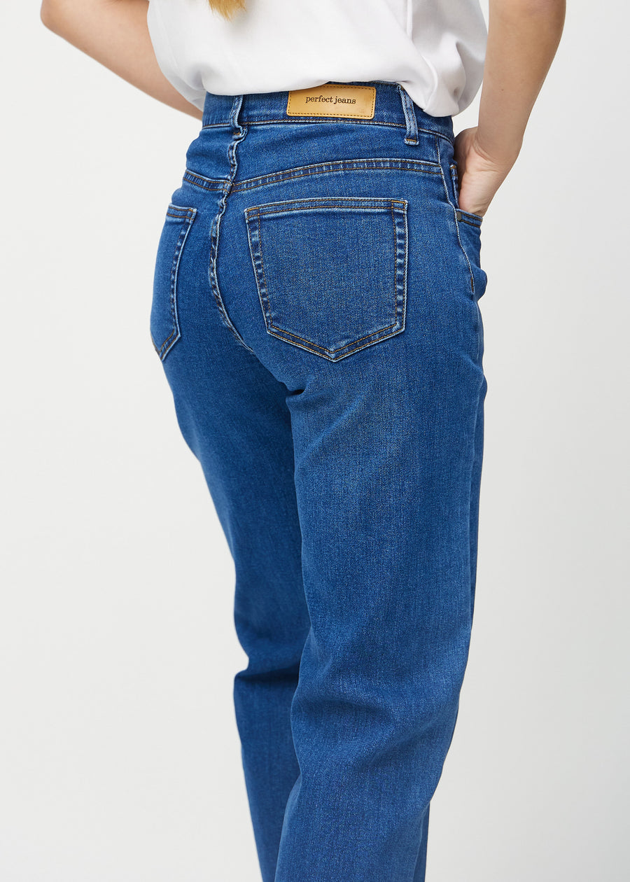 Dark denim loose jeans seen from the back close up to show details.