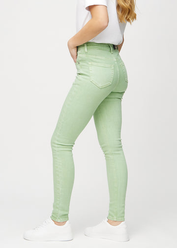 Skinny jeans for women in light green, color Mints. Side view on a model.