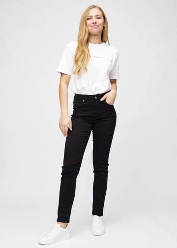Full image of a model in black slim jeans.