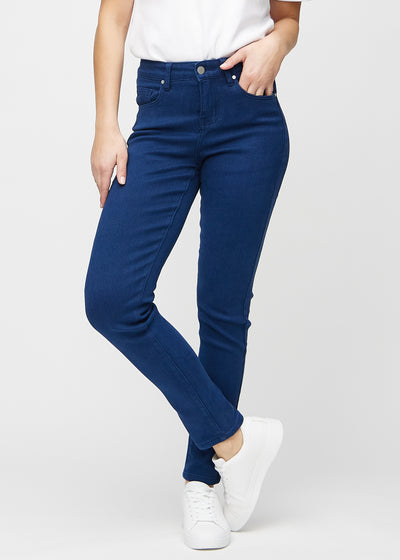 Slim jeans for women in dark blue, color Royals. Front view on a model, showing a close fit through the leg with a little more room at the ankle.