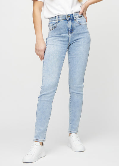 Slim jeans for women in light blue, color Waves. Front view on a model, showing a close fit through the leg with a little more room at the ankle.