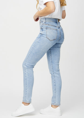 Slim jeans for women in light blue, color Waves. Side view on a model.