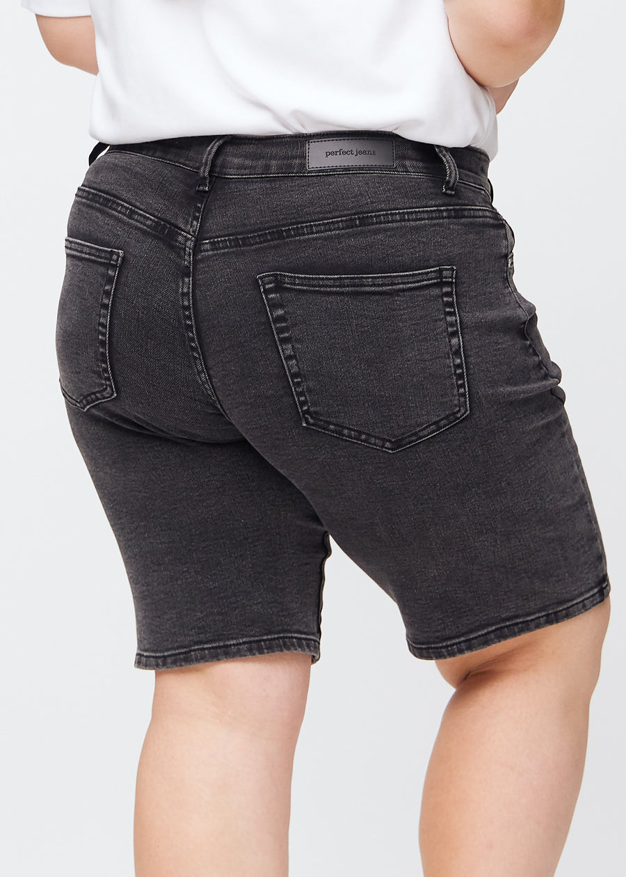 Dark grey denim regular middle shorts seen from the back up close on a plus-size model to show details.