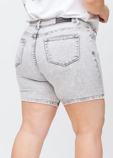 woman in light grey denim shorts