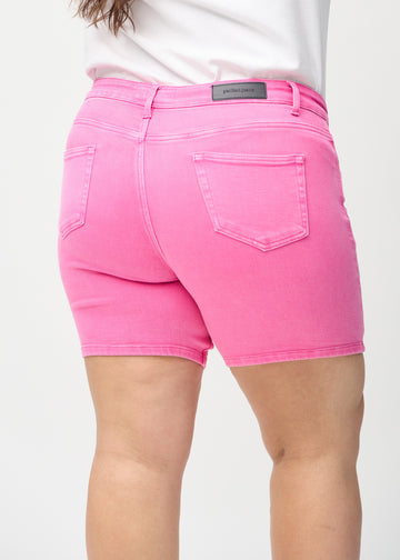 Light pink skinny short shorts seen from the back up close on a plus-size model to show details.