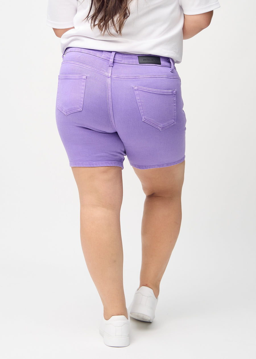 Purple skinny short shorts seen from the back on a plus-size model, so the full product can be seen.