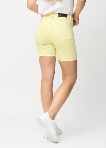 Light yellow skinny short shorts seen from the back, so the entire product can be seen.