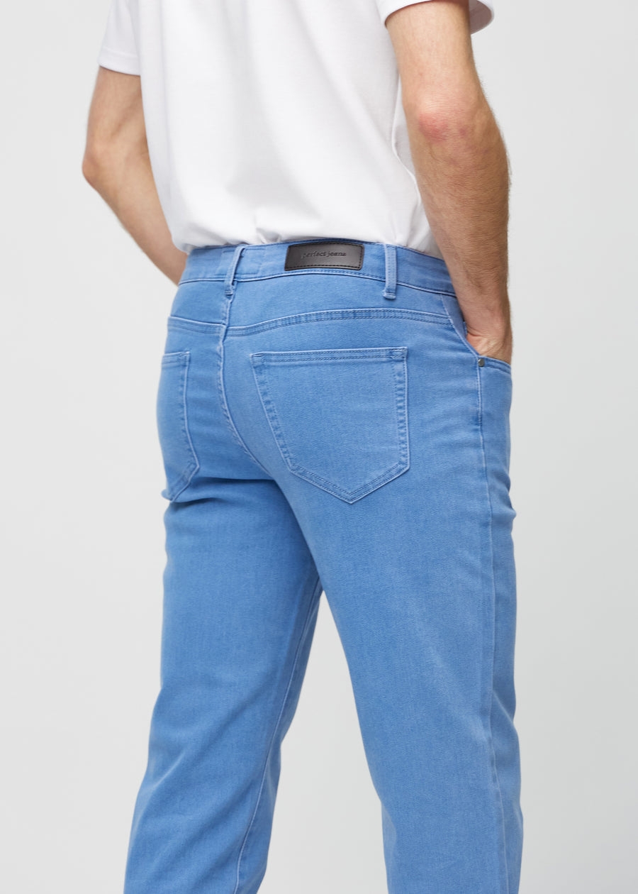 Blue regular jeans seen from the back close up to show details.