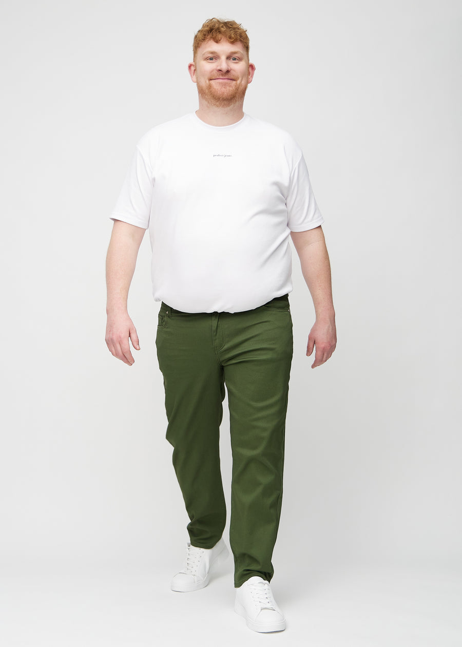 Full image of a plus-size model in dark green regular jeans.