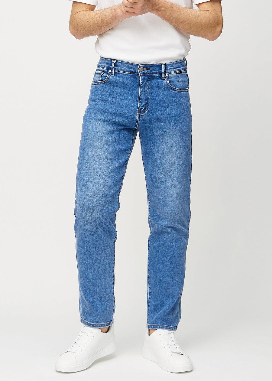 Denim regular jeans, model name Rivers, which runs straight down the leg, seen from the front.