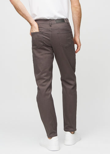 Grey-brown regular jeans seen from the back, so the entire product can be seen.