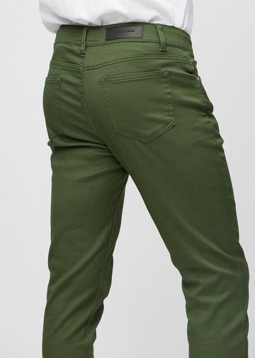Close-up back view of dark green slim jeans showing details.