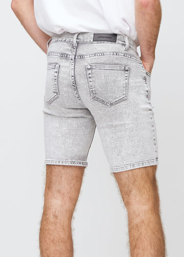 Light grey denim middle-slim shorts seen from the back close up to show details.